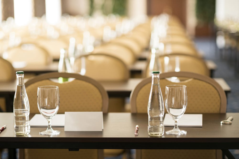 Banquet room set with water and glasses