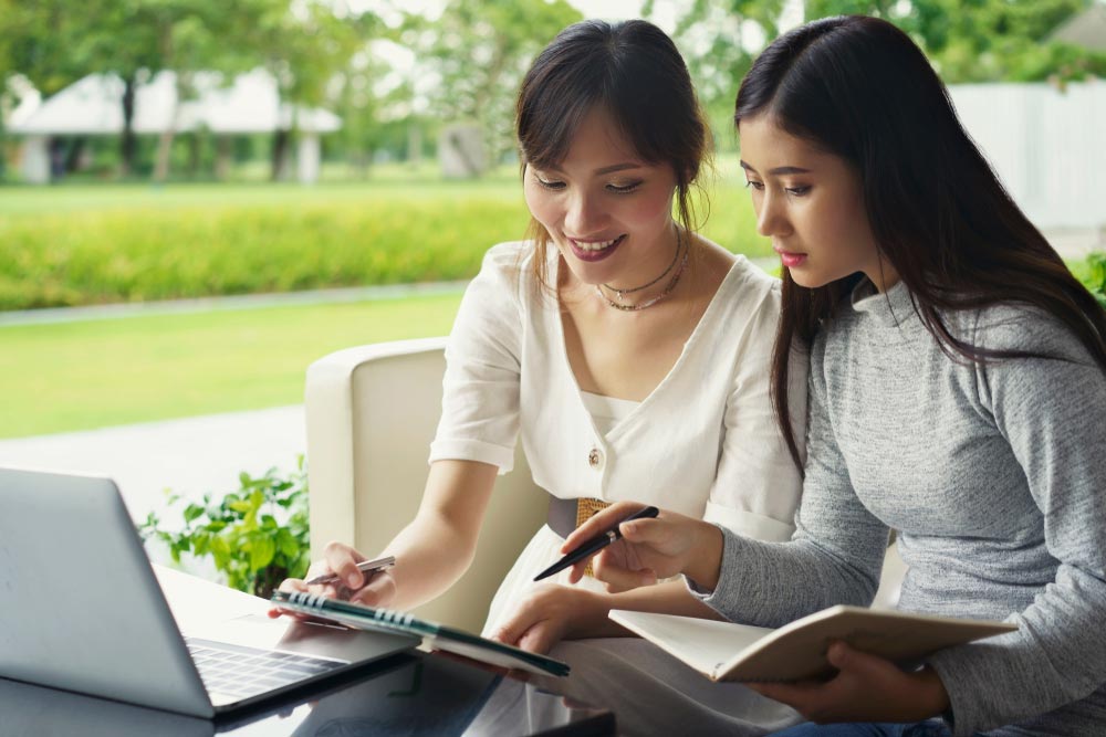 Event planner and client going over event details