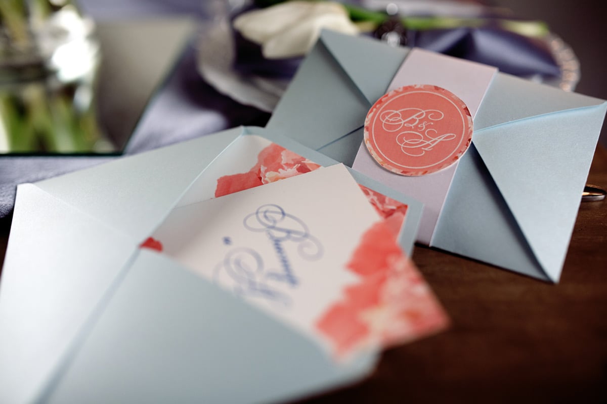 Modern wedding invitation in envelope with calligraphy seal