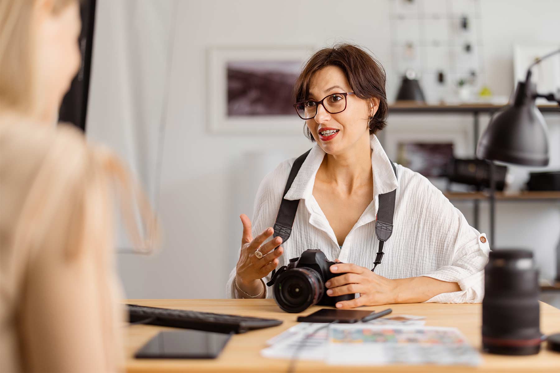 A photographer having a conversation with a client A photographer having a conversation with a client